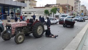 Traktörden asfalta düştüler, burunları bile kanamadı