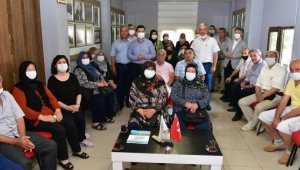 Tütüncü şehit aileleriyle hasret giderdi