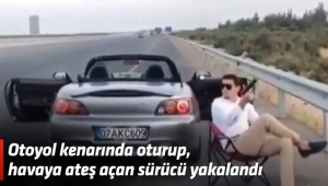 Otoyol kenarında oturup, havaya ateş açan sürücü yakalandı