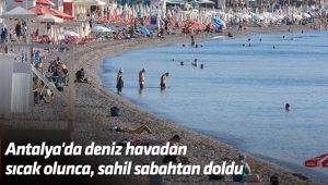 Antalya'da deniz havadan sıcak olunca, sahil sabahtan doldu