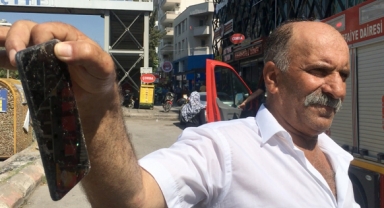 Kanala düşen telefonu itfaiye çıkardı