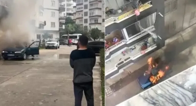 Yanan arabaya balkondan kovayla su döktü