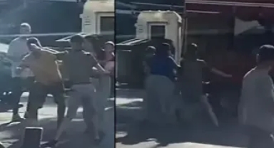 Seyyar satıcı ile müşterinin yumruk yumruğa kavgası kamerada