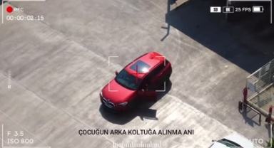 Kucağında çocukla araç kullanan sürücüye yasal işlem