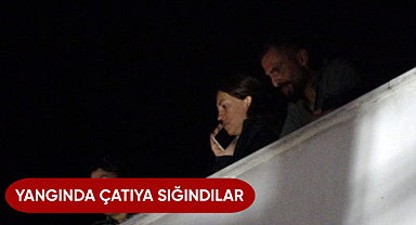 Yangında çatıya sığındılar