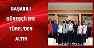 Başarılı güreşçilere Başkan Türel'den altın