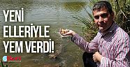 Çift kol nakilli, yeni elleriyle balıklara yem verdi
