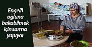 Engelli oğluna bakabilmek için sarma yapıyor